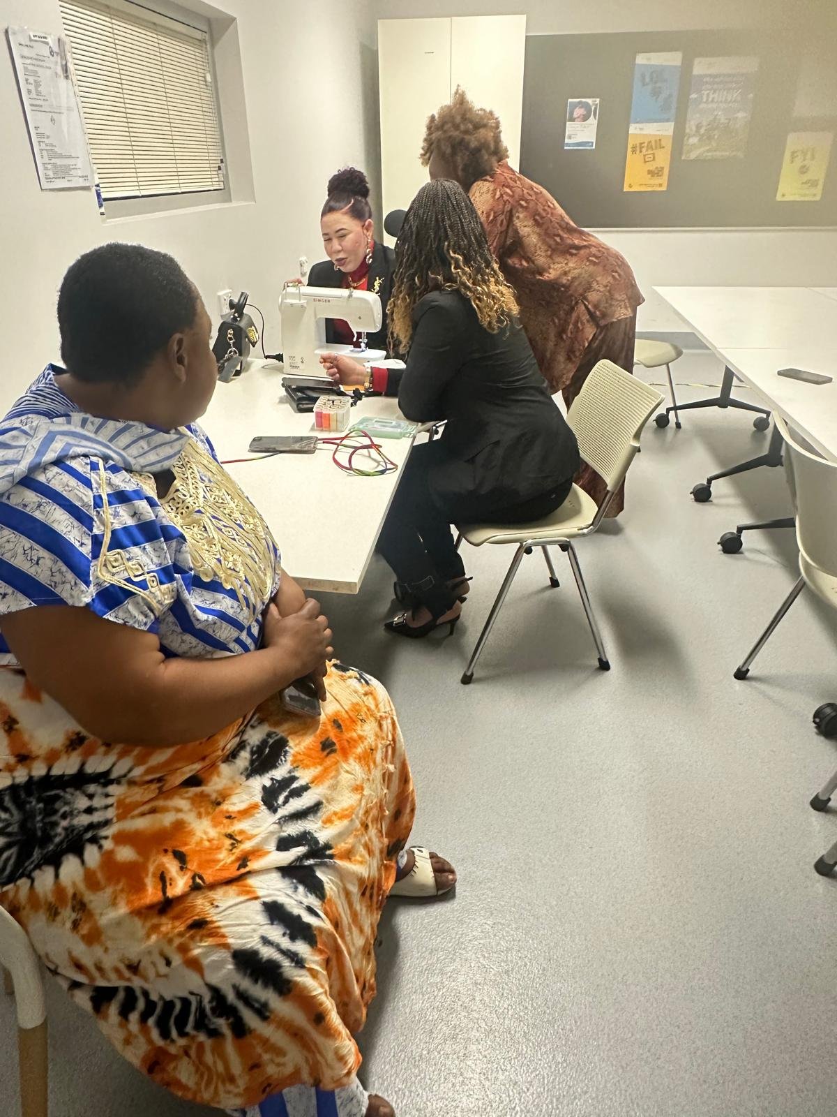 Group of elders and single mothers at a community gathering