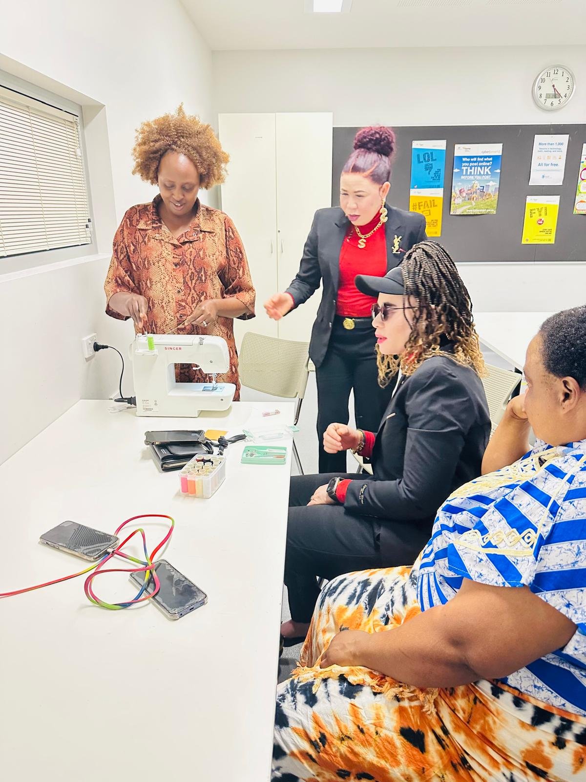 Close-up of sewing machine and African fabrics